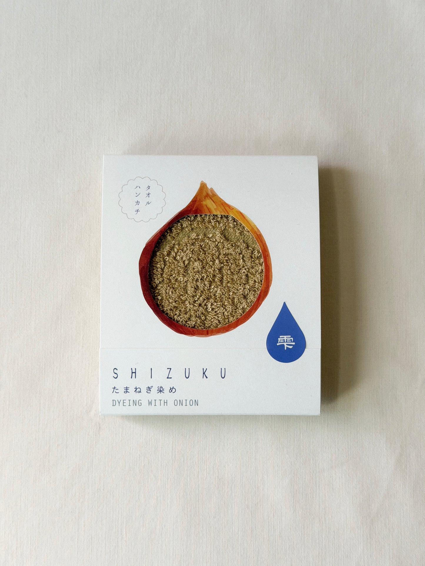 Packaged brown towel with a cut-out of an onion